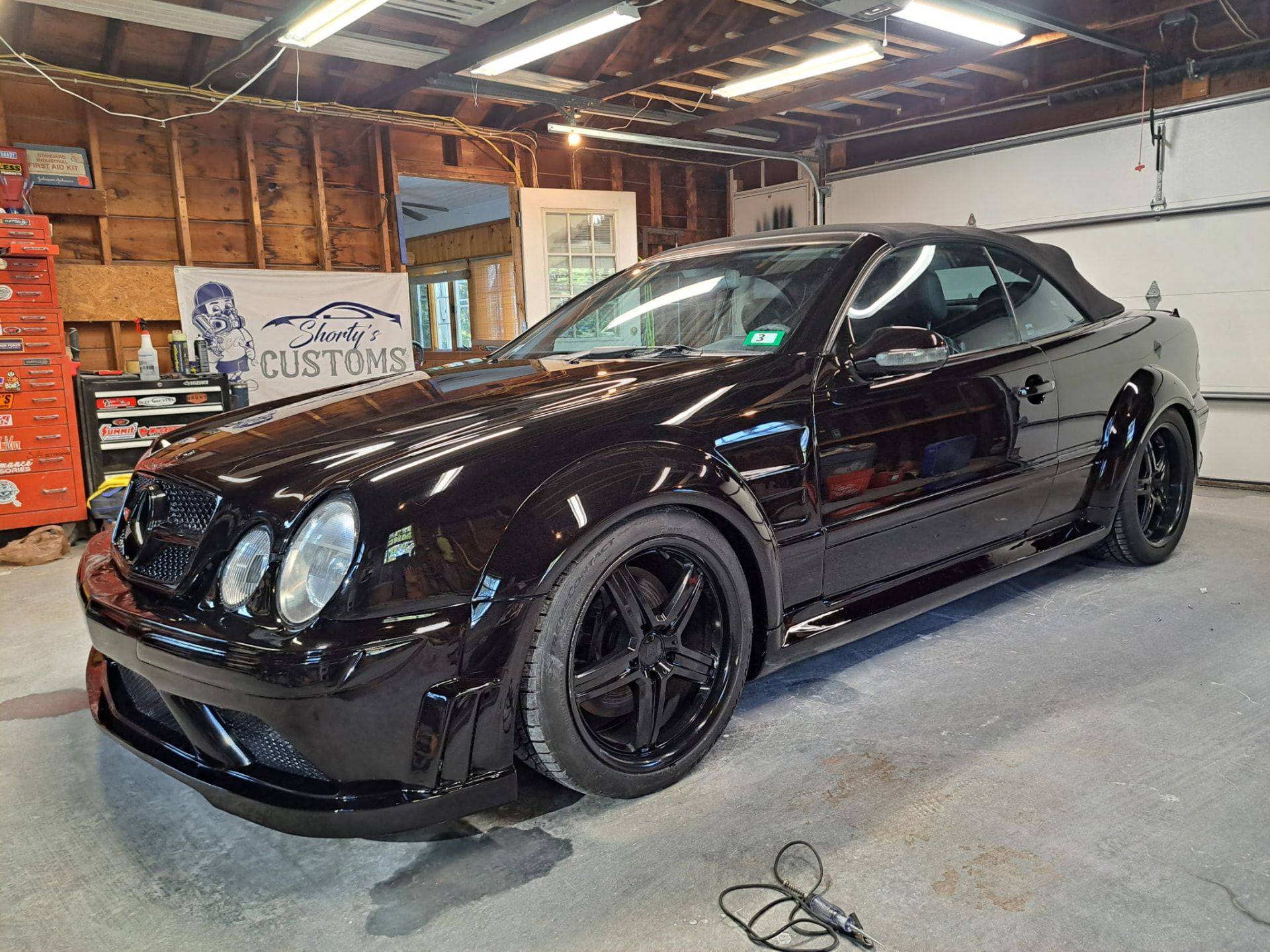 Finished black custom Mercedes convertible at Shorty's Customs